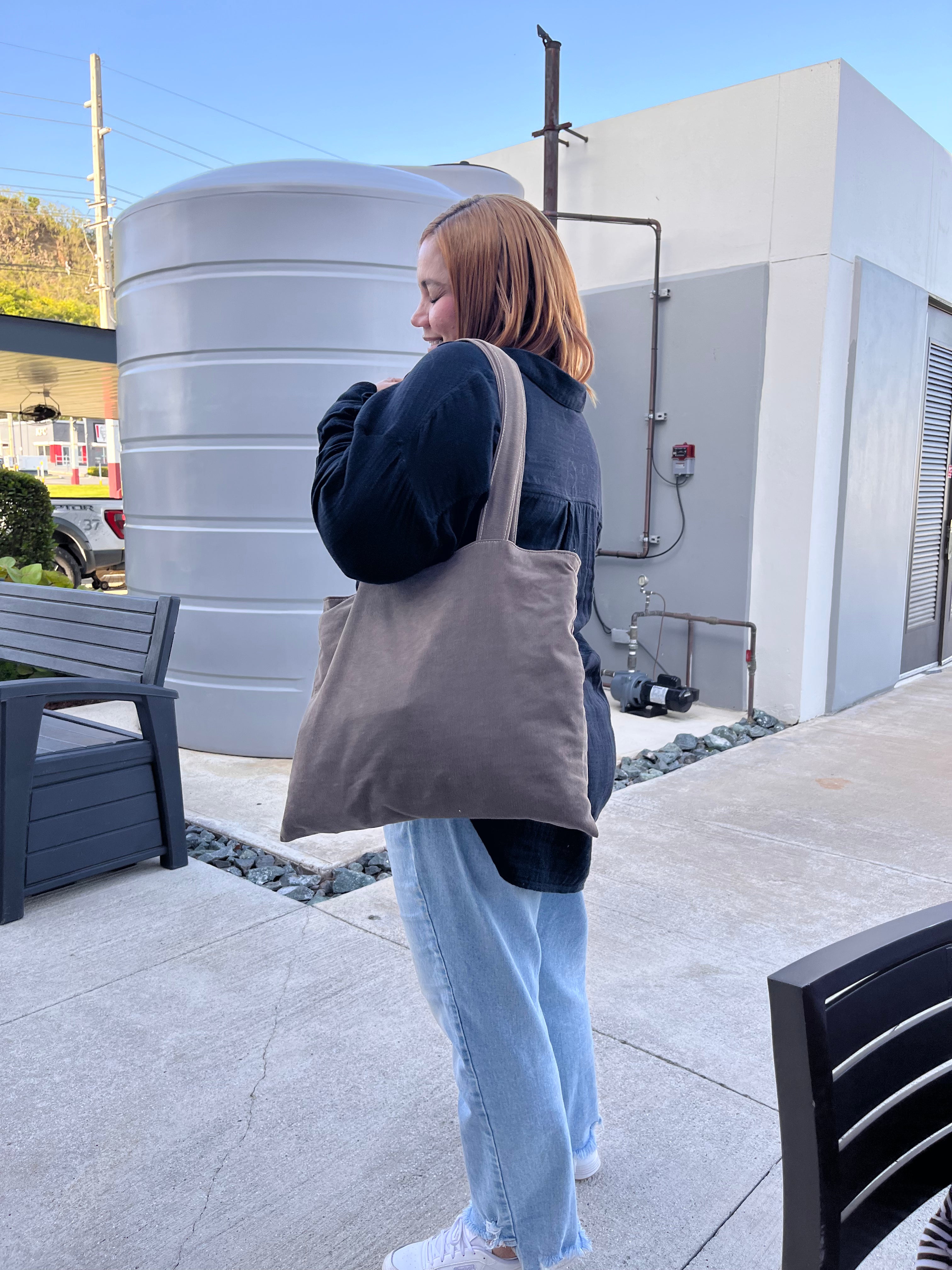 Happy customer wearing her Serendipia tote bag out in the street